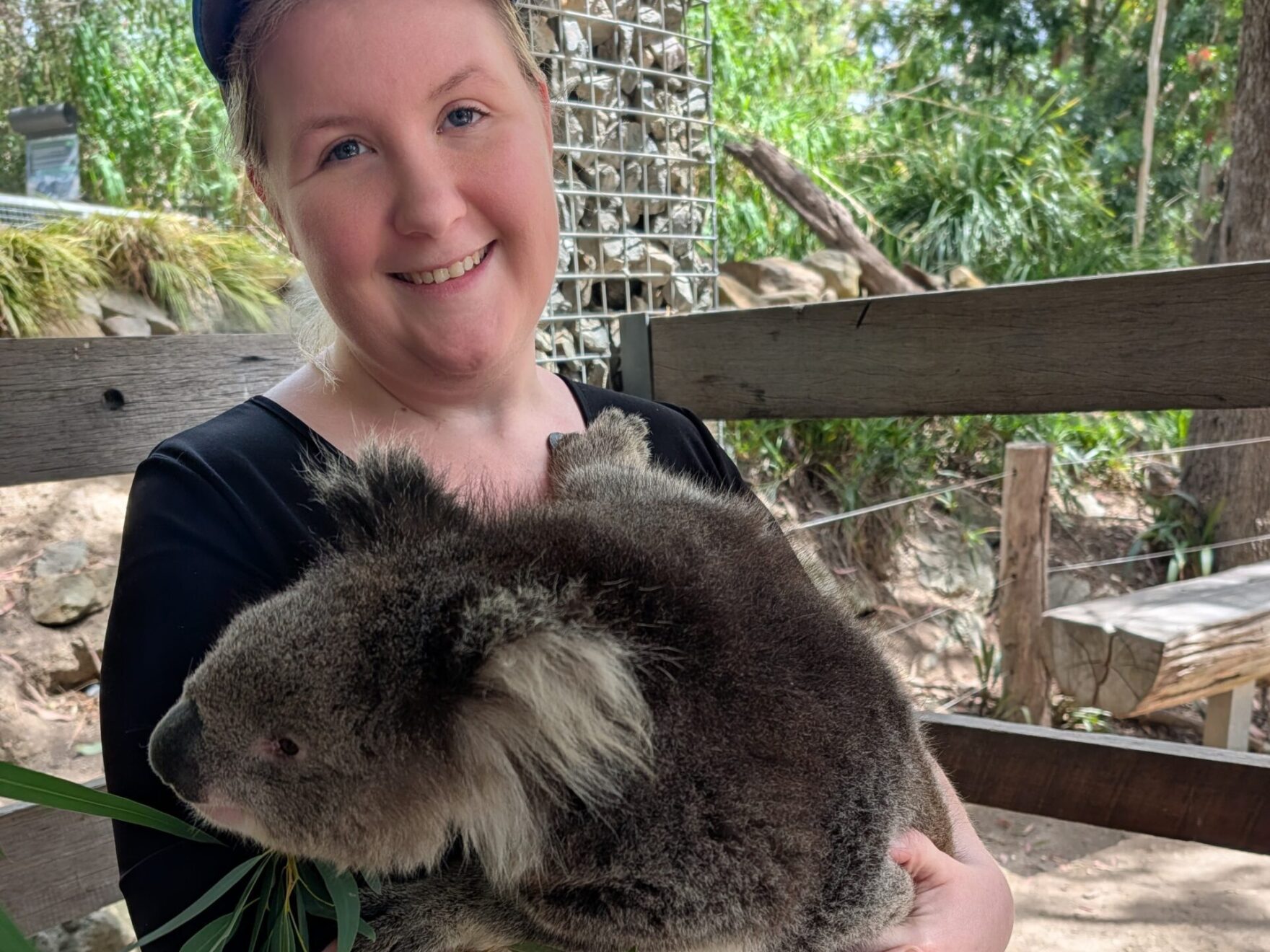 Woman holding a koala